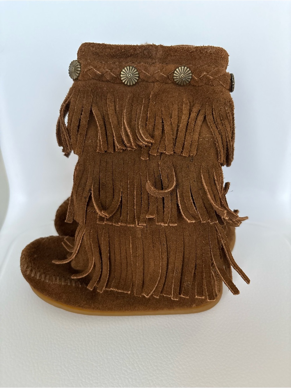 Minnetonka Leather Kids Triple Fringe Moccasin Boots in Brown